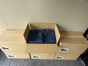 旧作業服を寄付しました